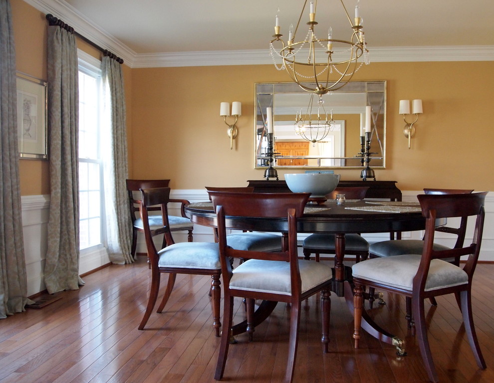 Photo of a traditional dining room in Baltimore with dark hardwood flooring and beige walls.