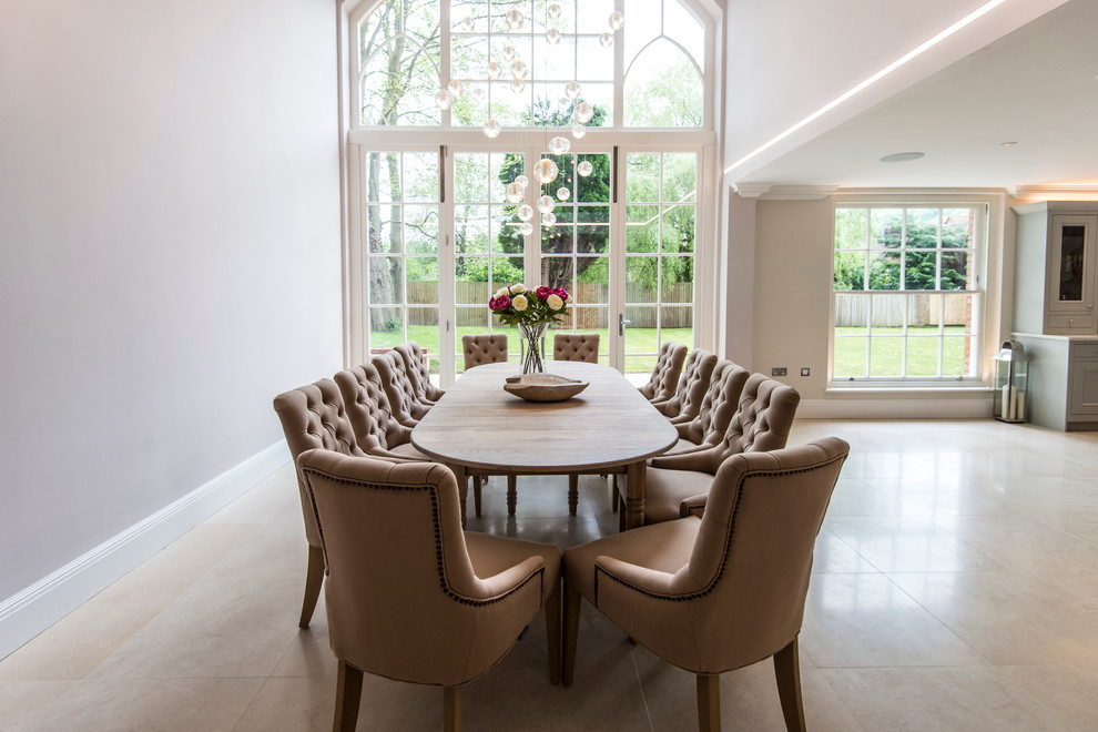 Large traditional kitchen/dining room in Surrey with beige walls and no fireplace.