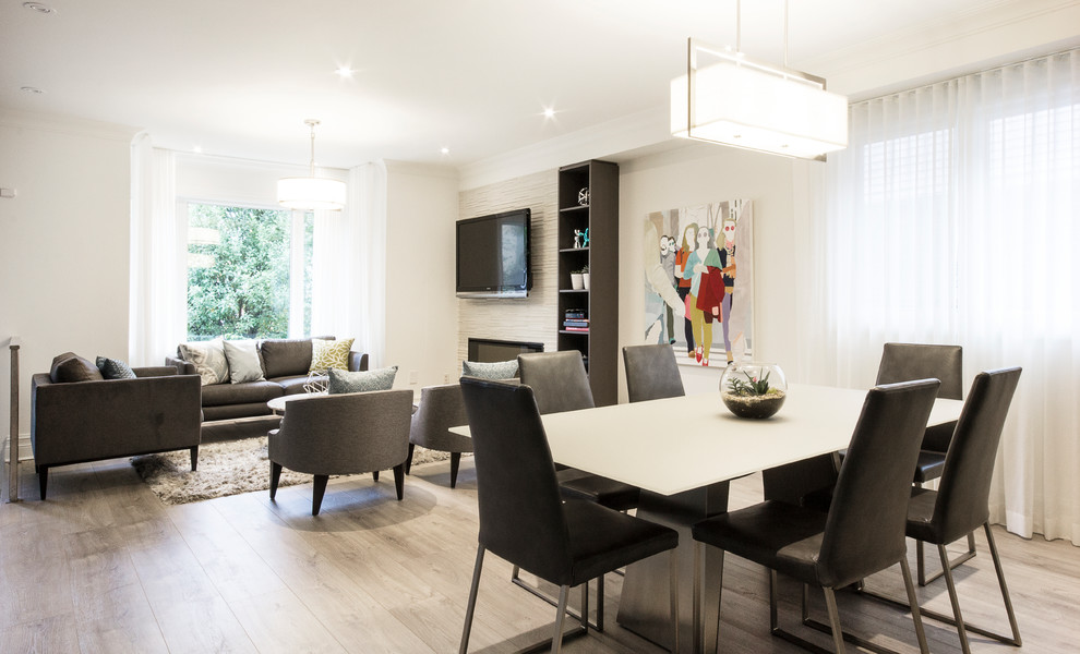 Photo of a contemporary dining room in Toronto with white walls.