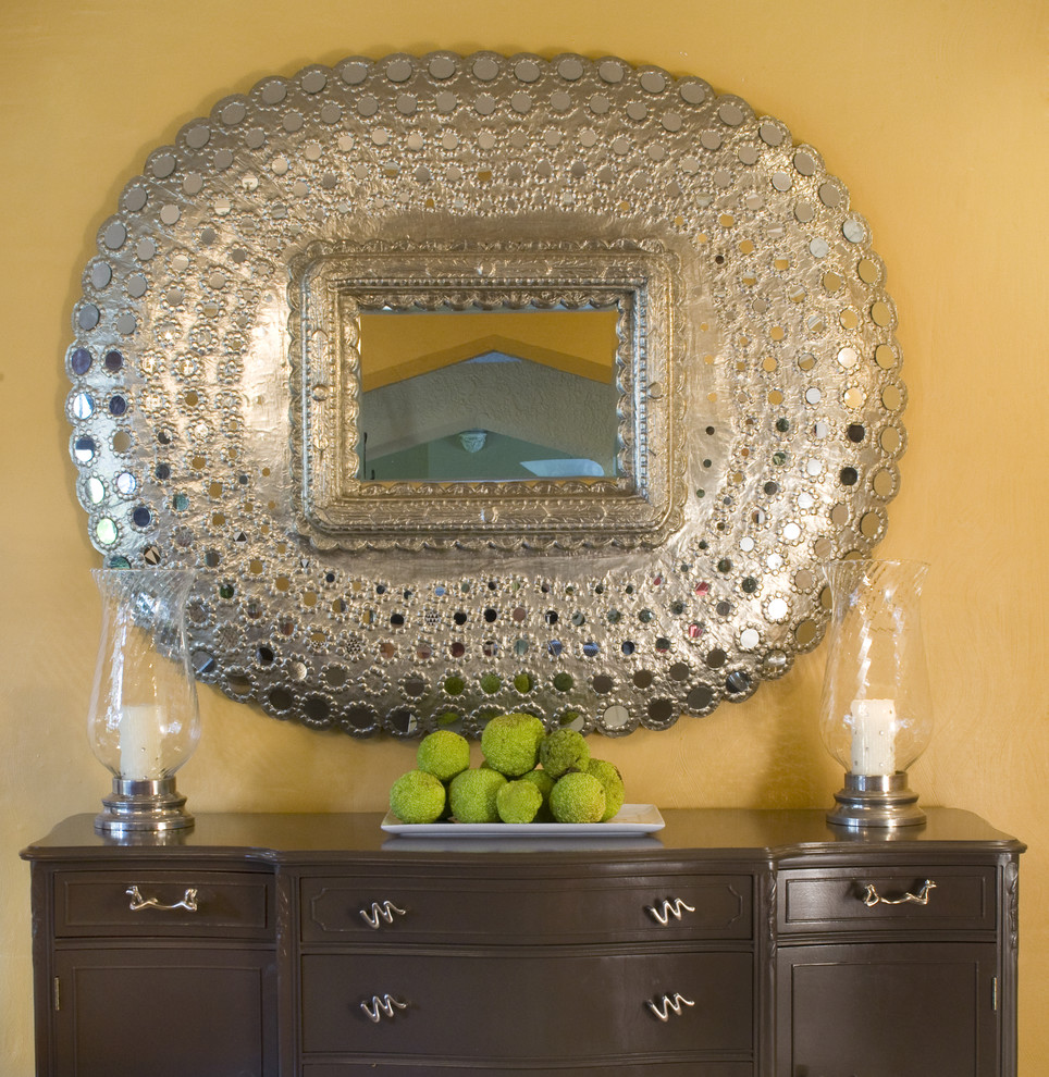 Elegant dining room photo in St Louis with yellow walls