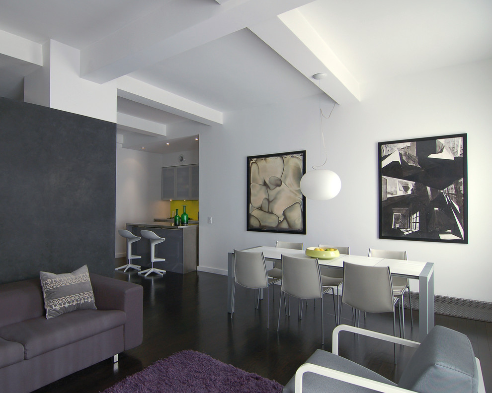 Immagine di una piccola sala da pranzo moderna con pareti bianche, parquet scuro e nessun camino