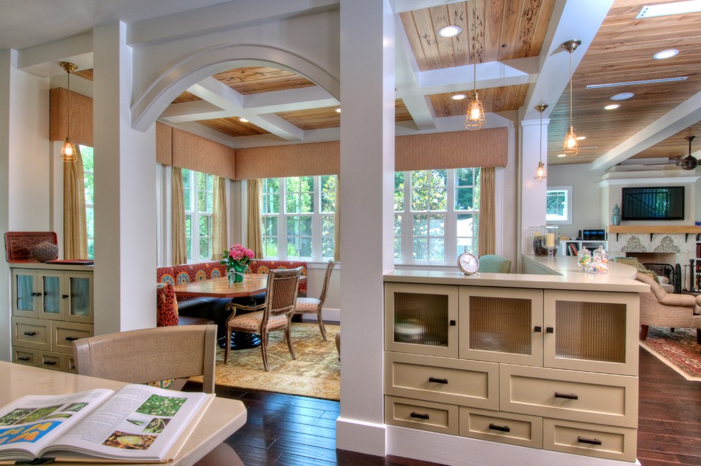 Example of a large trendy dark wood floor kitchen/dining room combo design in Tampa with beige walls