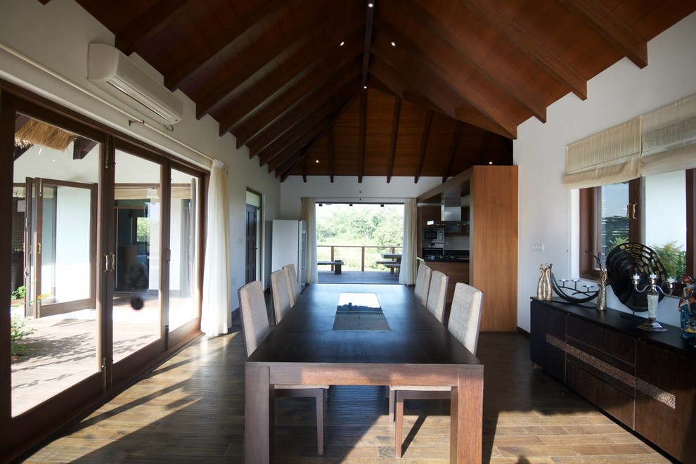 Example of an island style dining room design in Bengaluru