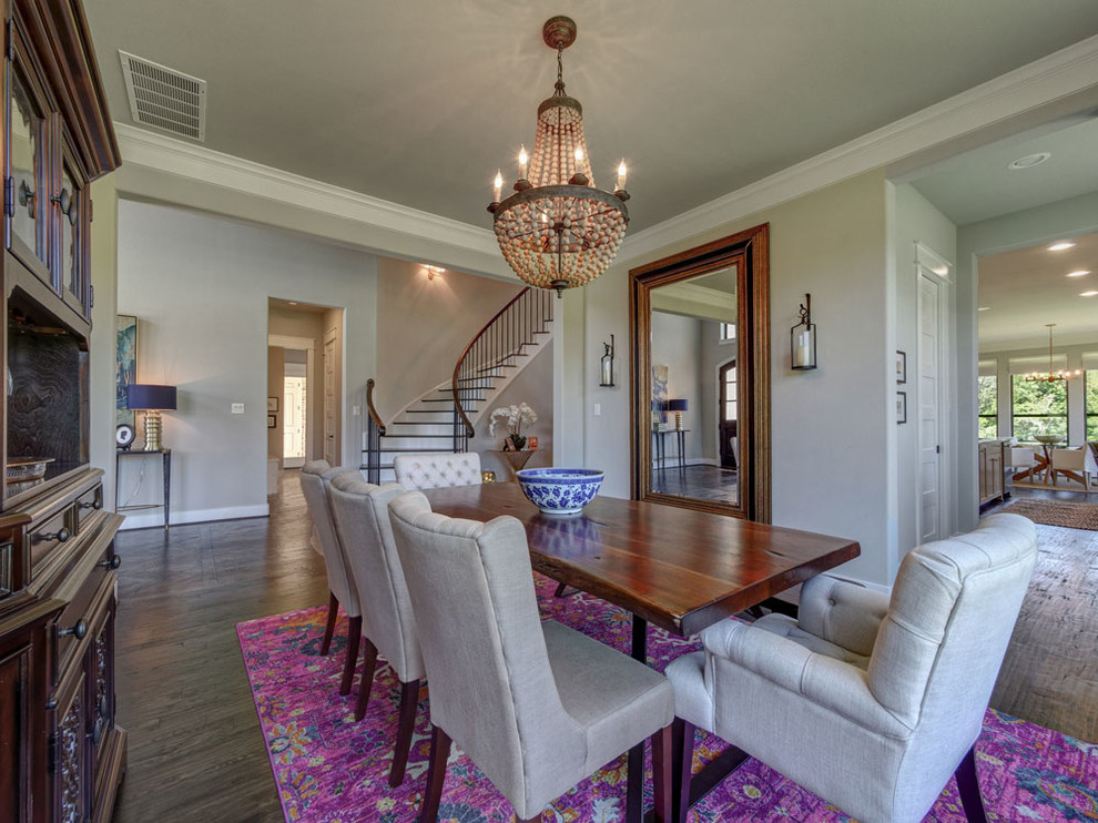 Medium sized vintage enclosed dining room in Dallas with grey walls, dark hardwood flooring, no fireplace and brown floors.