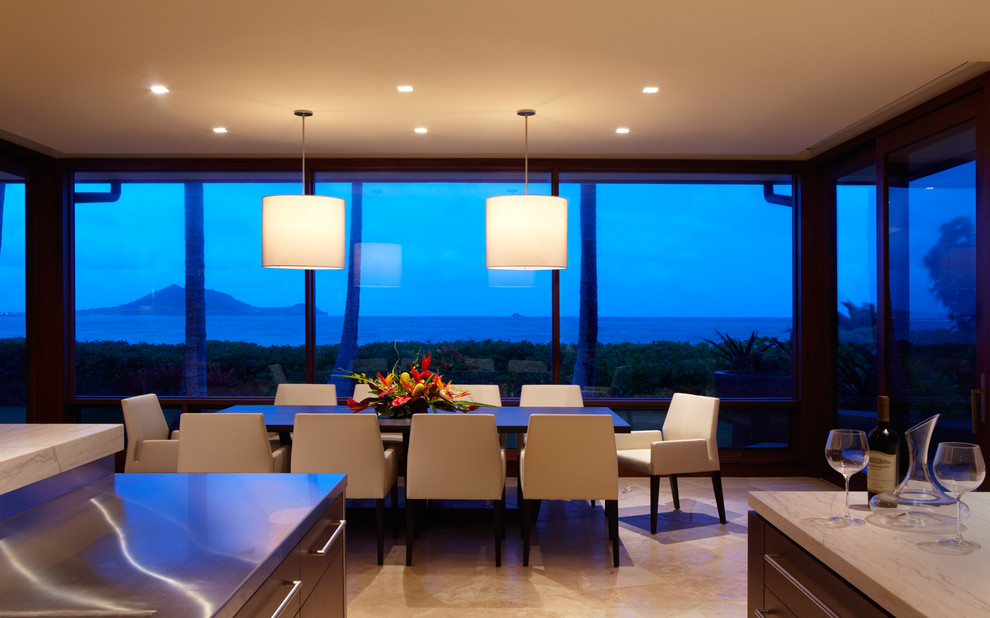 Example of an island style kitchen/dining room combo design in Hawaii