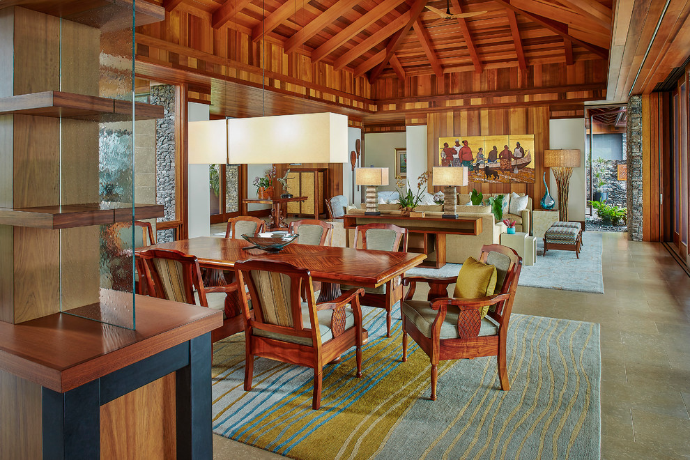 Example of a mid-sized island style great room design in Hawaii with white walls and no fireplace