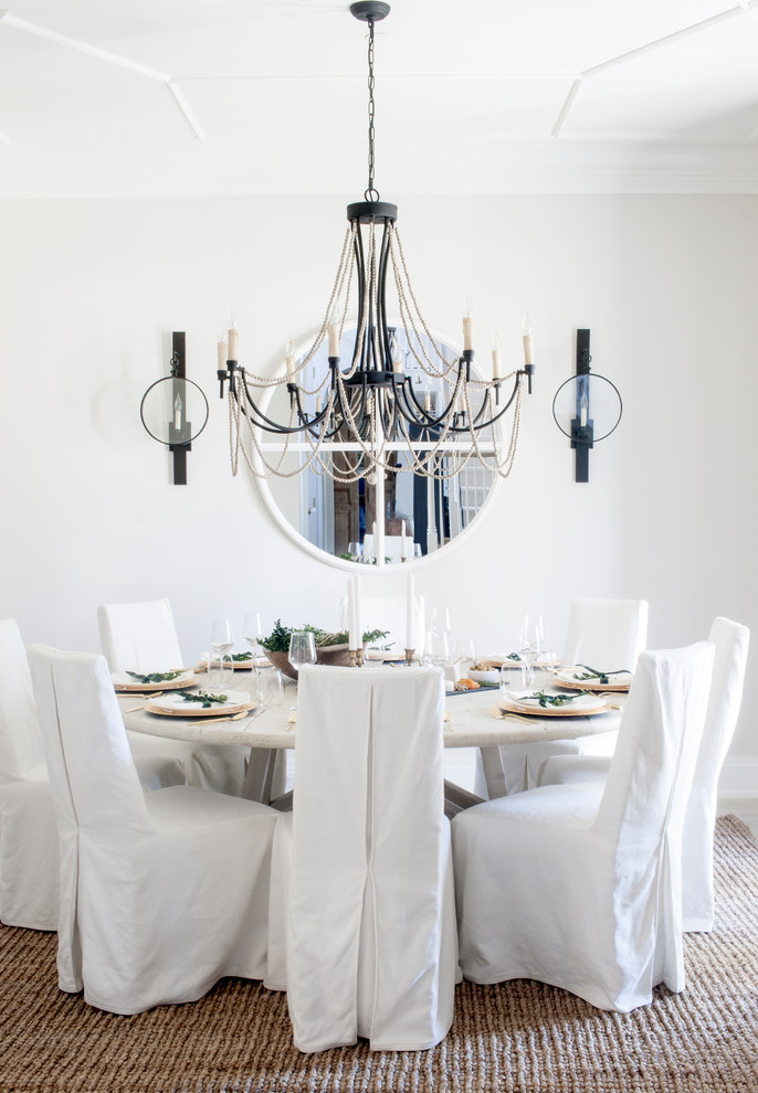 Inspiration for a country dining room in Chicago with white walls.