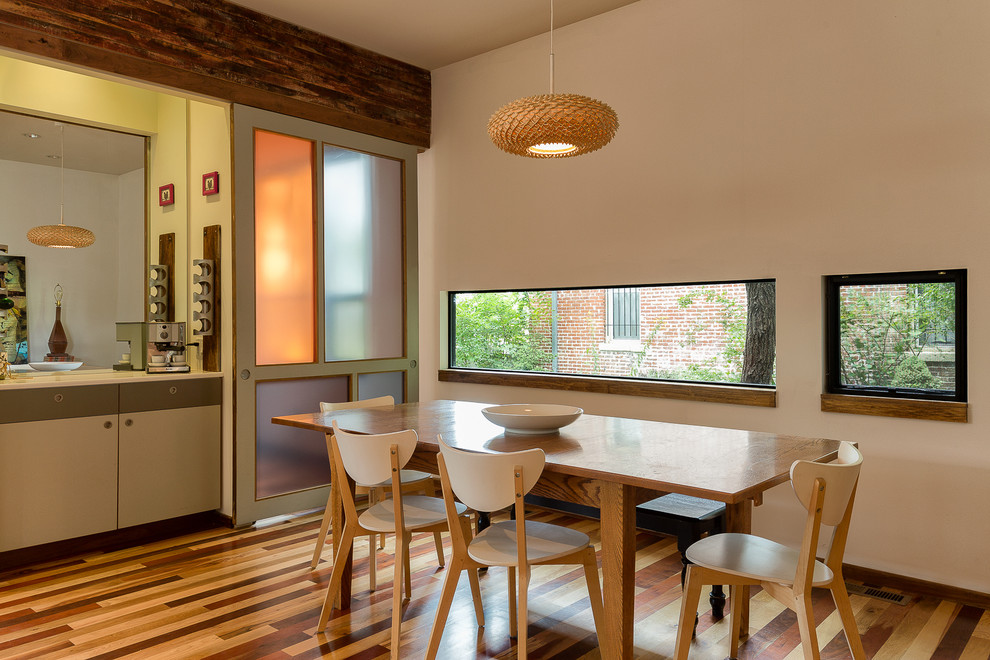 Dining room - contemporary dark wood floor dining room idea in Kansas City with beige walls