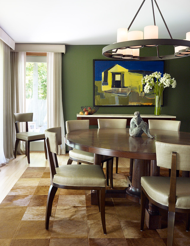Photo of a medium sized classic kitchen/dining room in Chicago with green walls and light hardwood flooring.