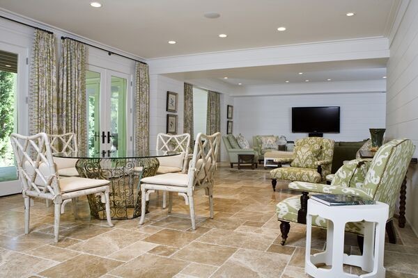 Inspiration for a mid-sized timeless limestone floor great room remodel in Atlanta with white walls and no fireplace