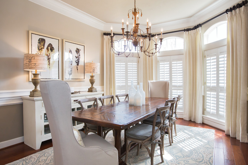This is an example of a classic enclosed dining room in Dallas with beige walls, medium hardwood flooring and no fireplace.