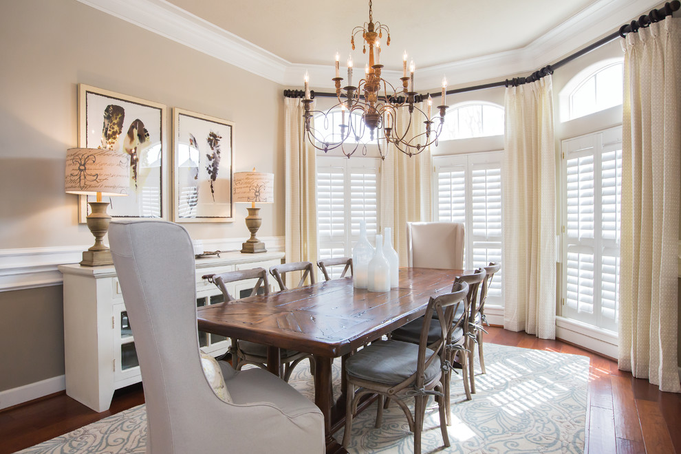 Elegant medium tone wood floor enclosed dining room photo in Dallas with beige walls and no fireplace