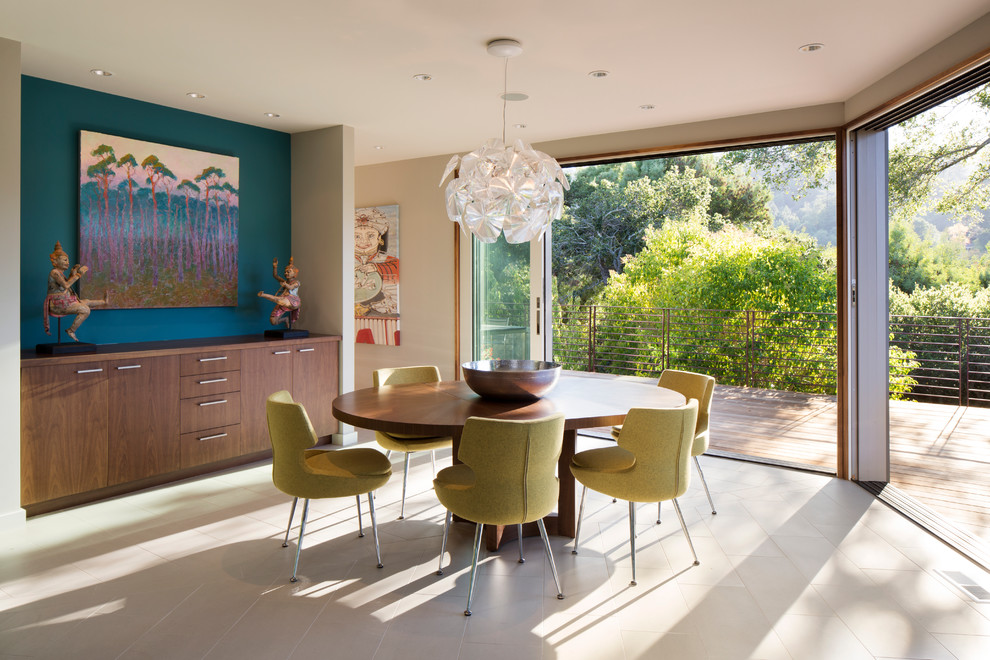 Contemporary dining room in San Francisco with blue walls and ceramic flooring.