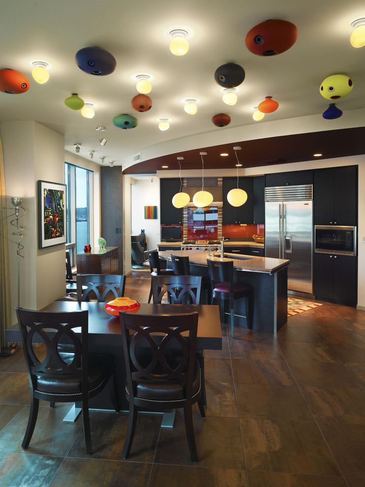 Esempio di una sala da pranzo aperta verso la cucina design