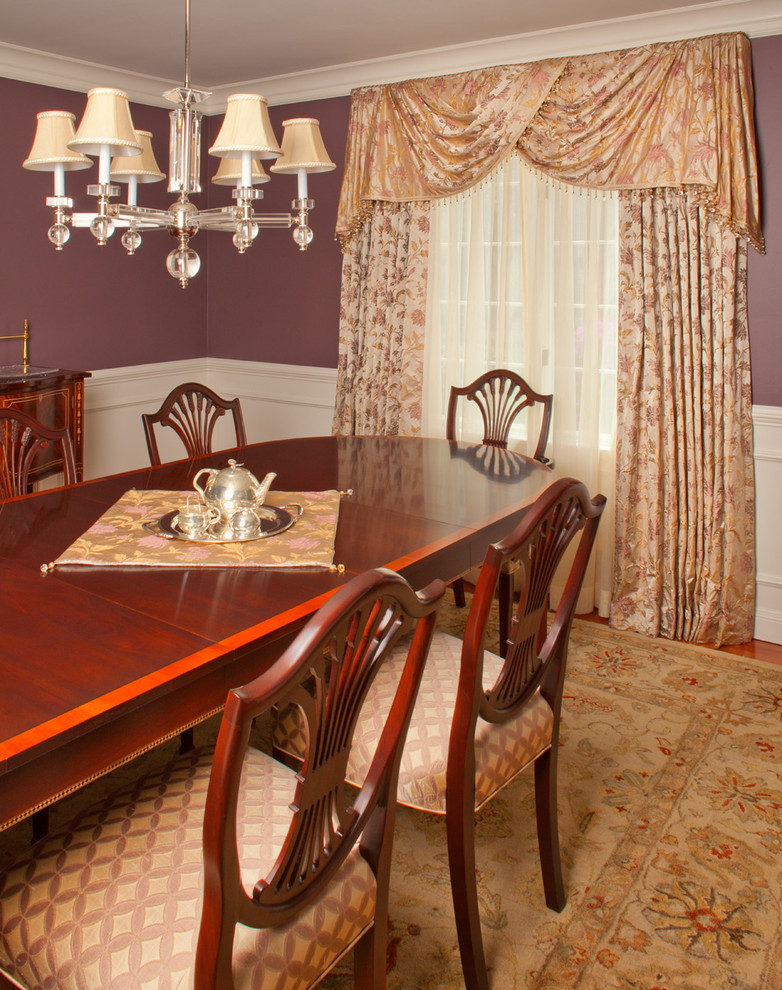This is an example of a medium sized classic enclosed dining room in Boston with purple walls, medium hardwood flooring, no fireplace and brown floors.