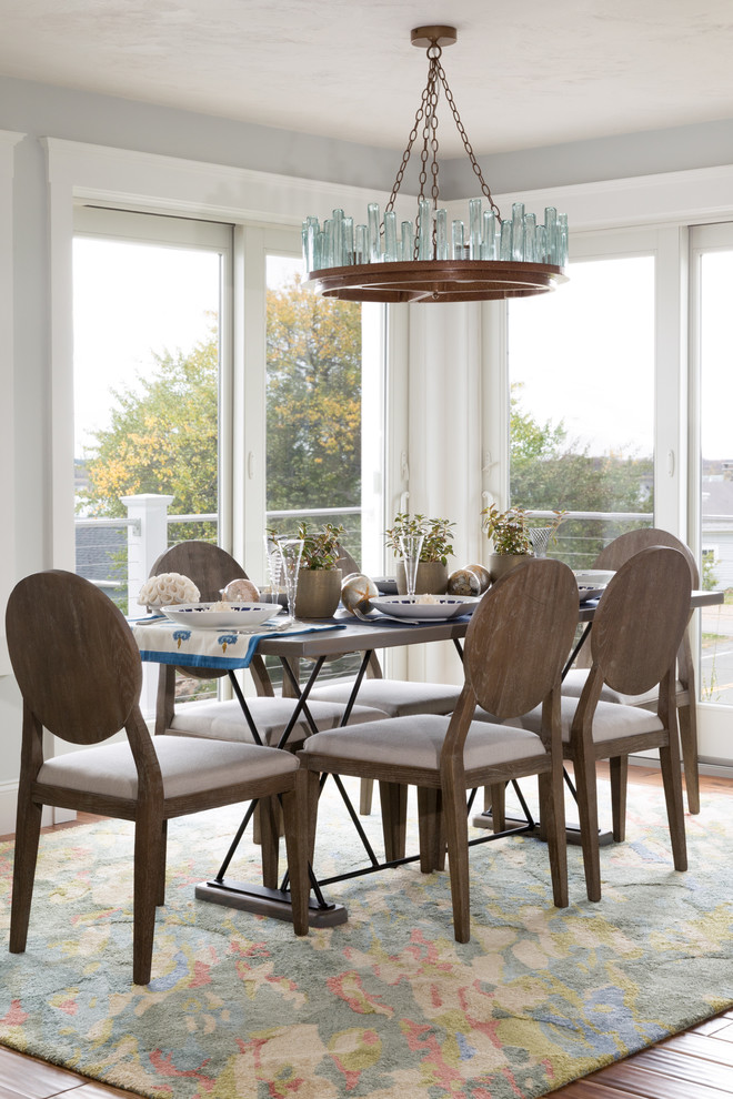 Design ideas for a coastal dining room in Boston with blue walls.