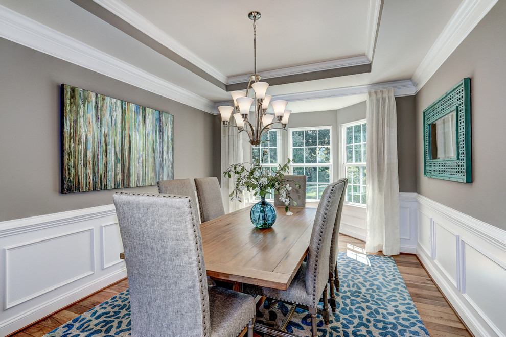 Inspiration for a medium sized classic enclosed dining room in DC Metro with grey walls, medium hardwood flooring and no fireplace.