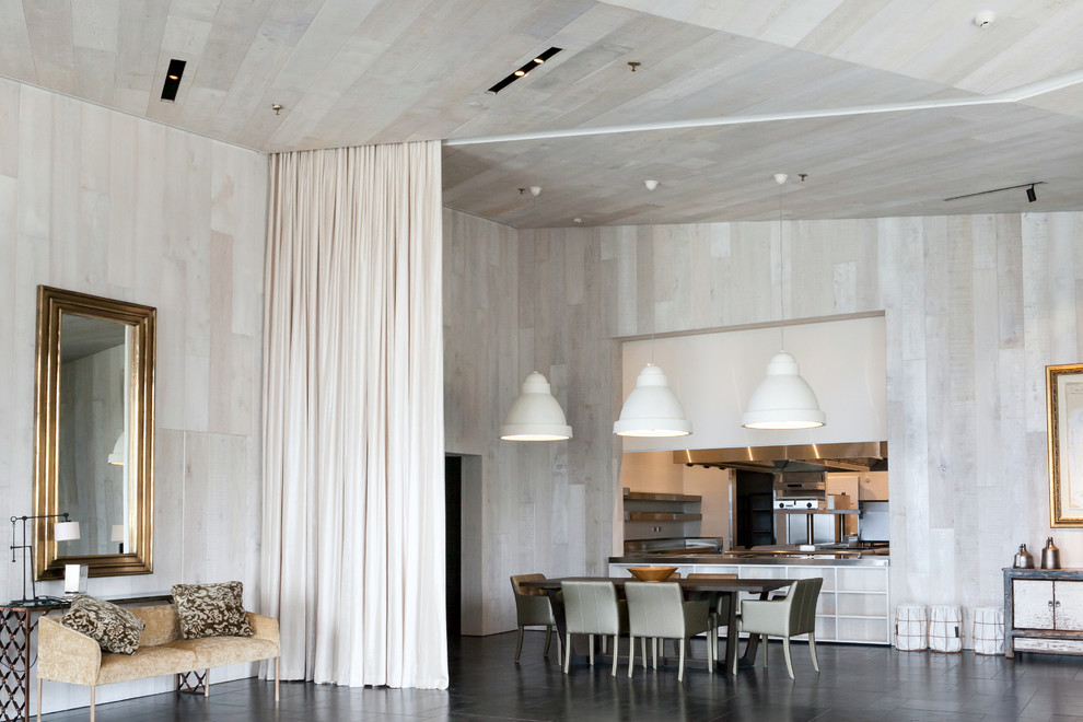 Inspiration for a large rustic marble floor great room remodel in Auckland with white walls