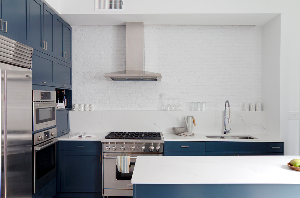 Example of a mid-sized danish porcelain tile and gray floor eat-in kitchen design in New York