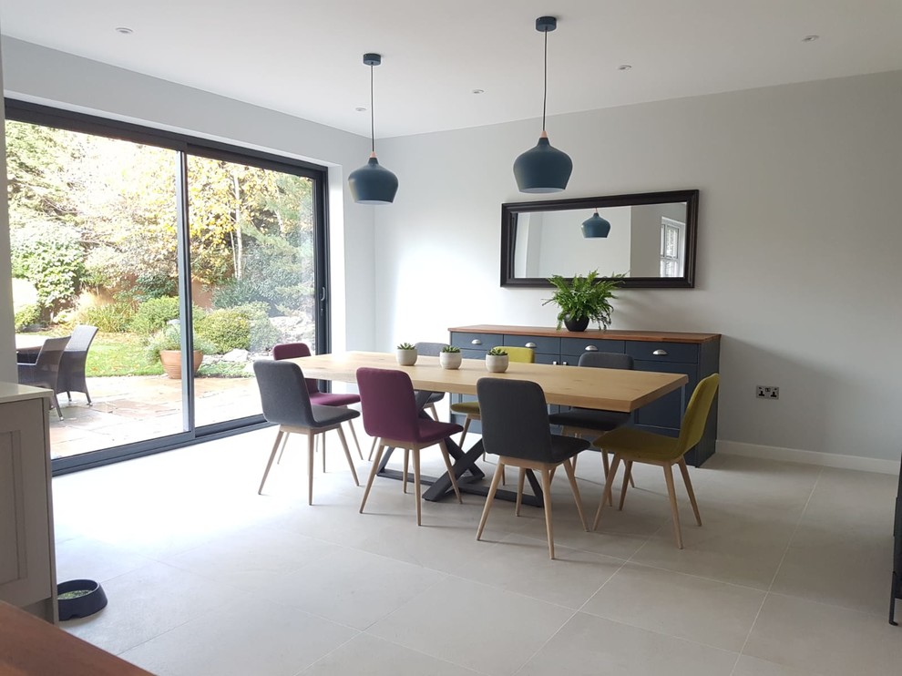 Photo of a large scandi kitchen/dining room in Hertfordshire with grey walls, porcelain flooring and grey floors.
