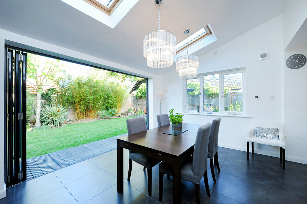 Contemporary dining room in Hampshire.