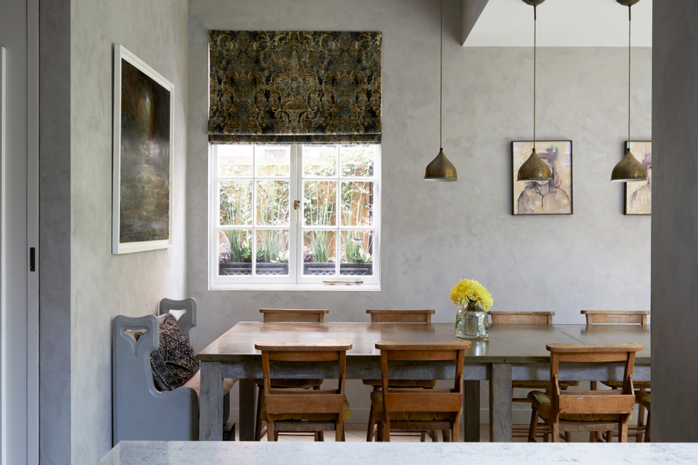Design ideas for a traditional dining room in London with grey walls.