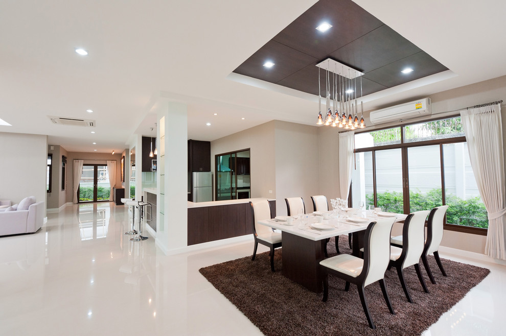 Design ideas for a contemporary open plan dining room in Bengaluru.