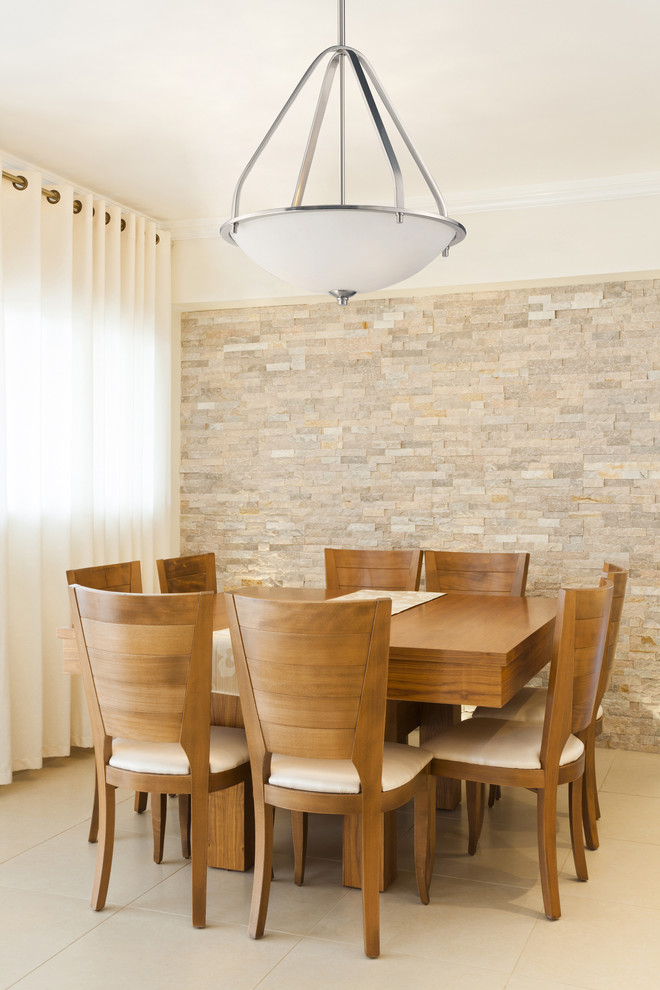 Enclosed dining room - mid-sized contemporary ceramic tile enclosed dining room idea in New York with beige walls