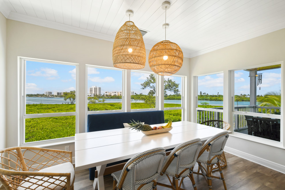 Inspiration for a mid-sized coastal porcelain tile, brown floor and shiplap ceiling great room remodel in Other