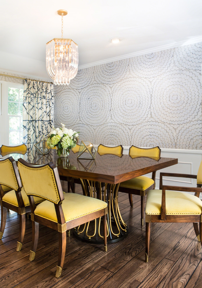 Inspiration for a mid-sized transitional medium tone wood floor enclosed dining room remodel in Los Angeles with white walls