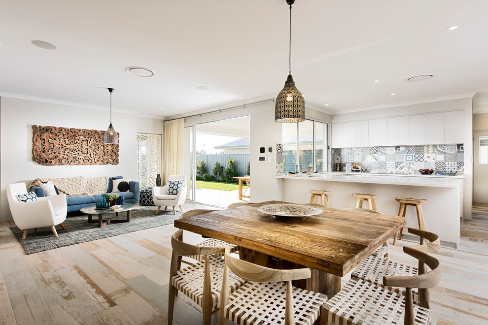 Mid-sized danish light wood floor great room photo in Perth with white walls