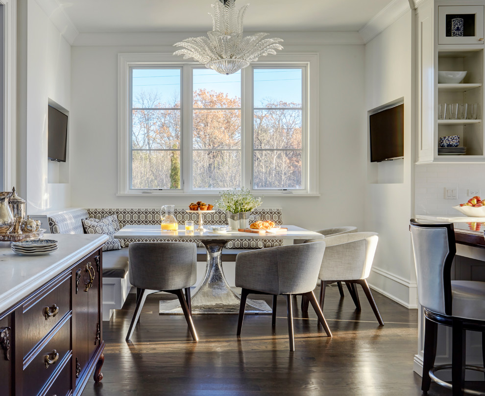 Elegant dark wood floor and brown floor kitchen/dining room combo photo in Chicago with white walls