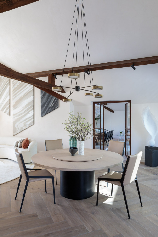 Photo of a contemporary open plan dining room in Other with white walls, medium hardwood flooring, no fireplace, brown floors and exposed beams.
