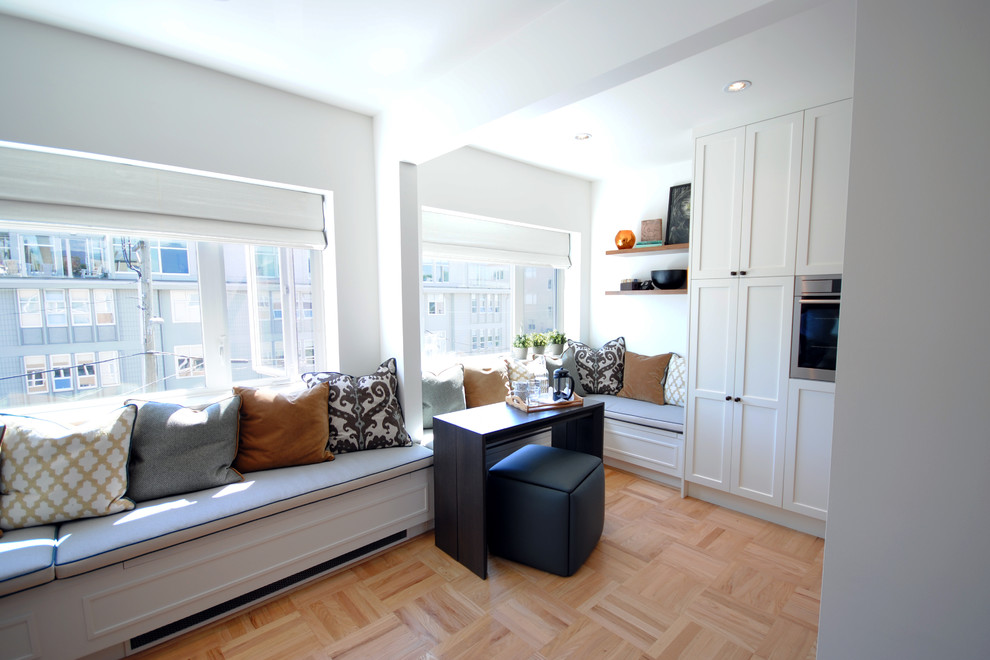 Inspiration for a small contemporary light wood floor kitchen/dining room combo remodel in Vancouver with white walls