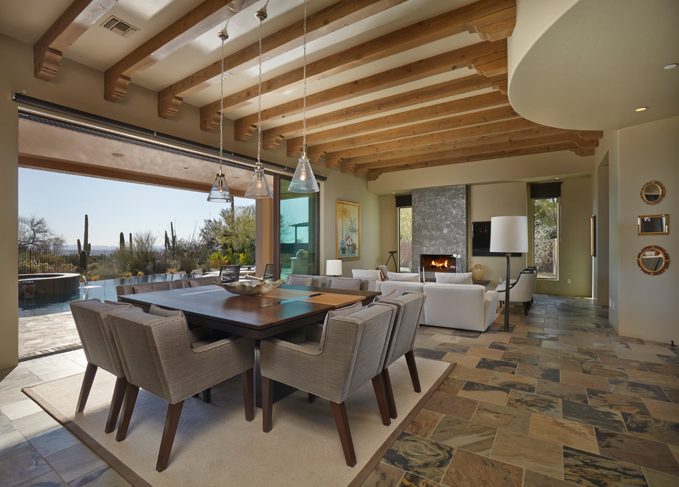 Contemporary dining room in Phoenix with beige walls.