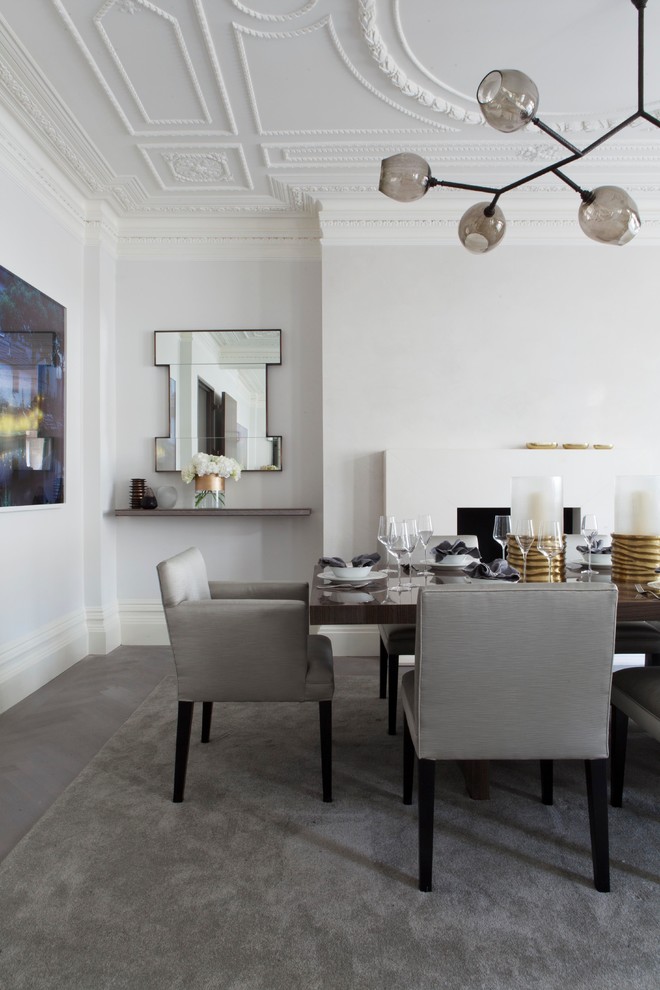 Trendy dining room photo in London with gray walls