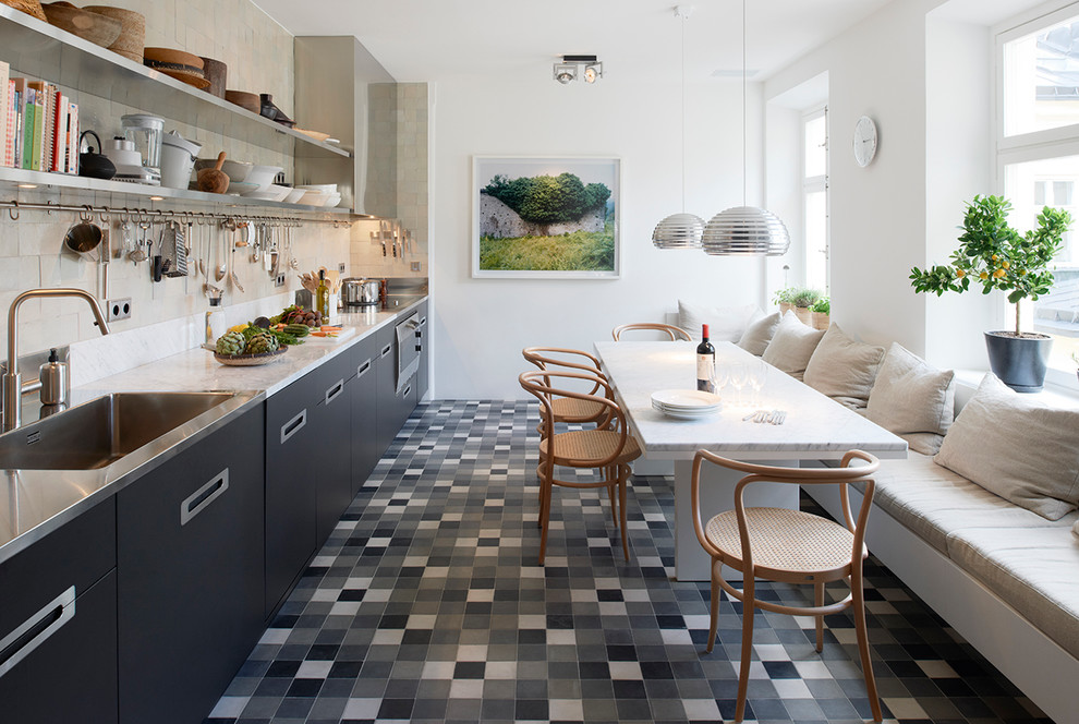 Kitchen/dining room combo - large contemporary ceramic tile kitchen/dining room combo idea in Stockholm with white walls and no fireplace