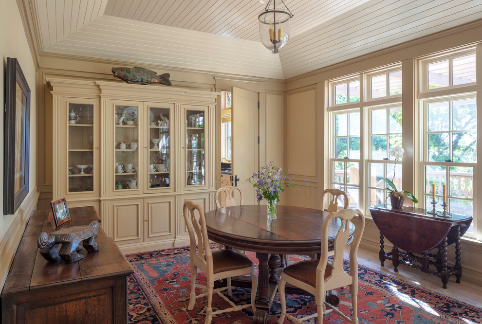 Enclosed dining room - traditional medium tone wood floor and brown floor enclosed dining room idea in San Francisco with beige walls