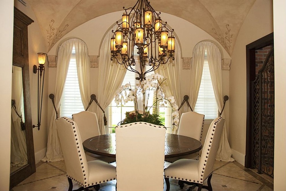 Tuscan dining room photo in Miami