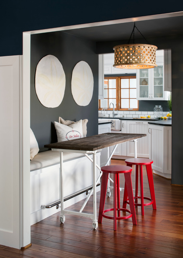 Inspiration for a mid-sized coastal medium tone wood floor kitchen/dining room combo remodel in San Francisco with gray walls and no fireplace