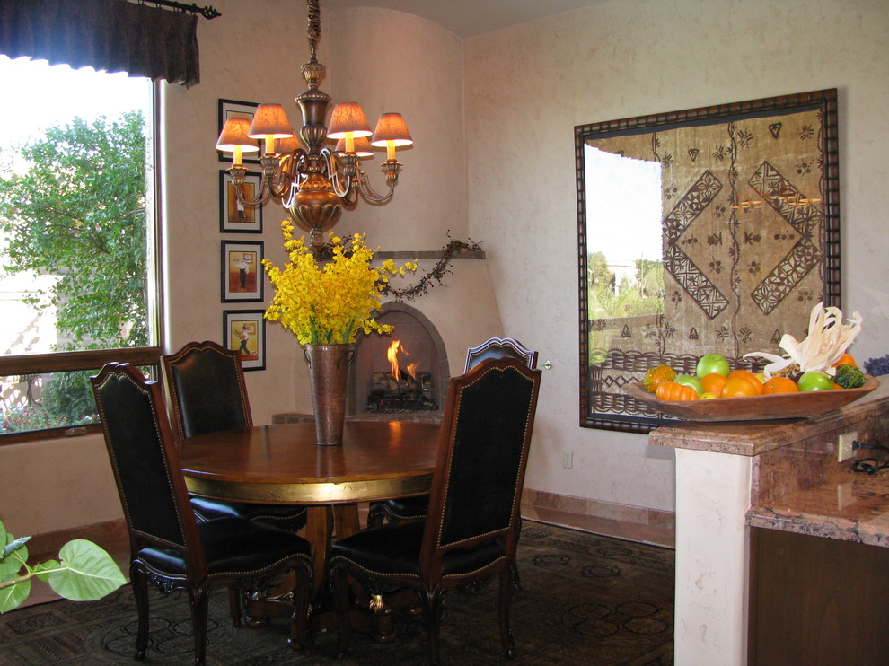 Medium sized mediterranean open plan dining room in Phoenix with beige walls, porcelain flooring, a corner fireplace, a plastered fireplace surround and beige floors.