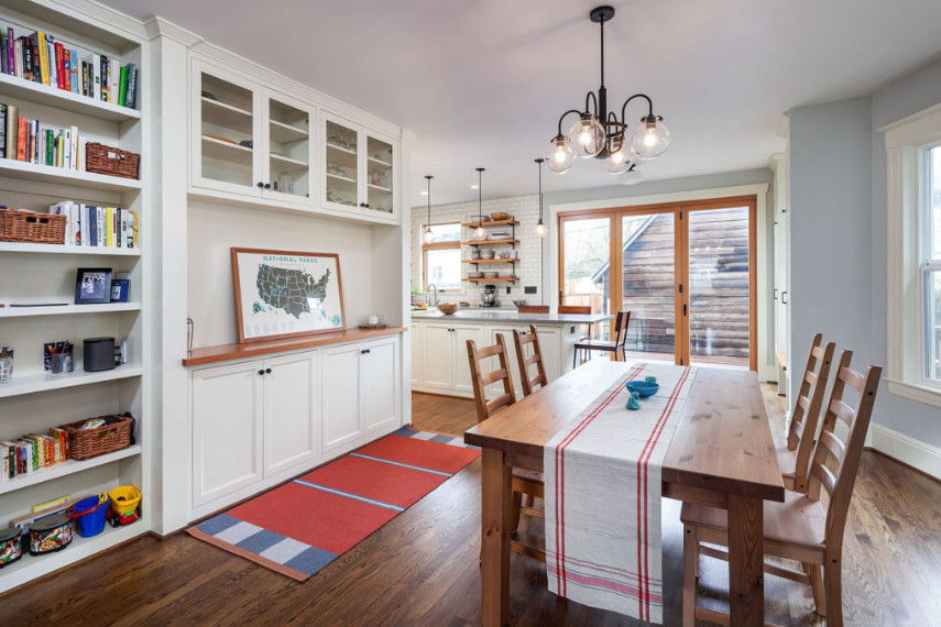 This is an example of a medium sized traditional kitchen/dining room in Portland with grey walls, medium hardwood flooring, no fireplace and brown floors.