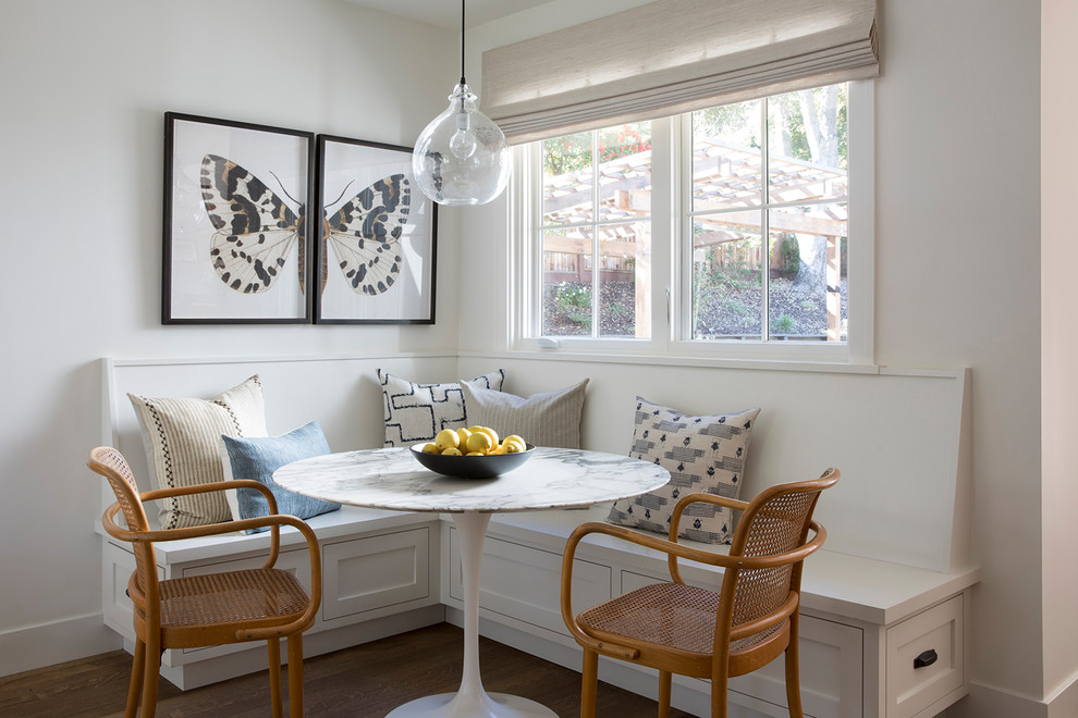 Inspiration for a mid-sized transitional brown floor and medium tone wood floor kitchen/dining room combo remodel in San Francisco with white walls
