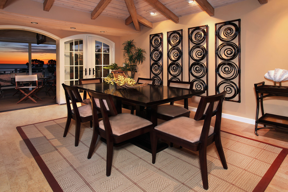 Inspiration for a tropical dining room remodel in Orange County
