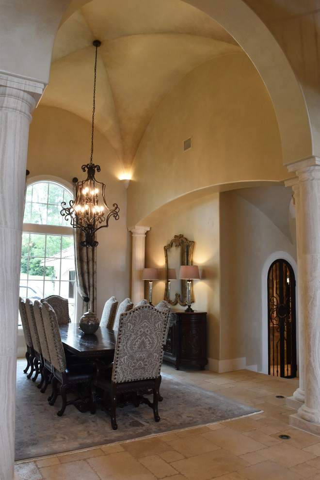 Great room - huge mediterranean travertine floor great room idea in Houston with beige walls and no fireplace