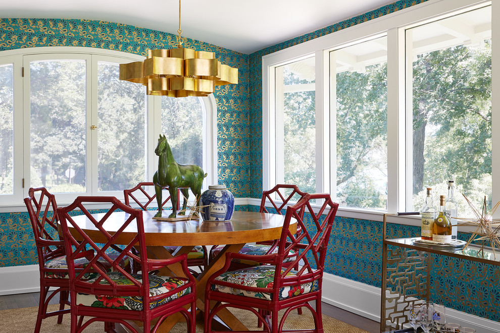 Example of a mid-sized eclectic dark wood floor and brown floor enclosed dining room design in Minneapolis with blue walls and no fireplace