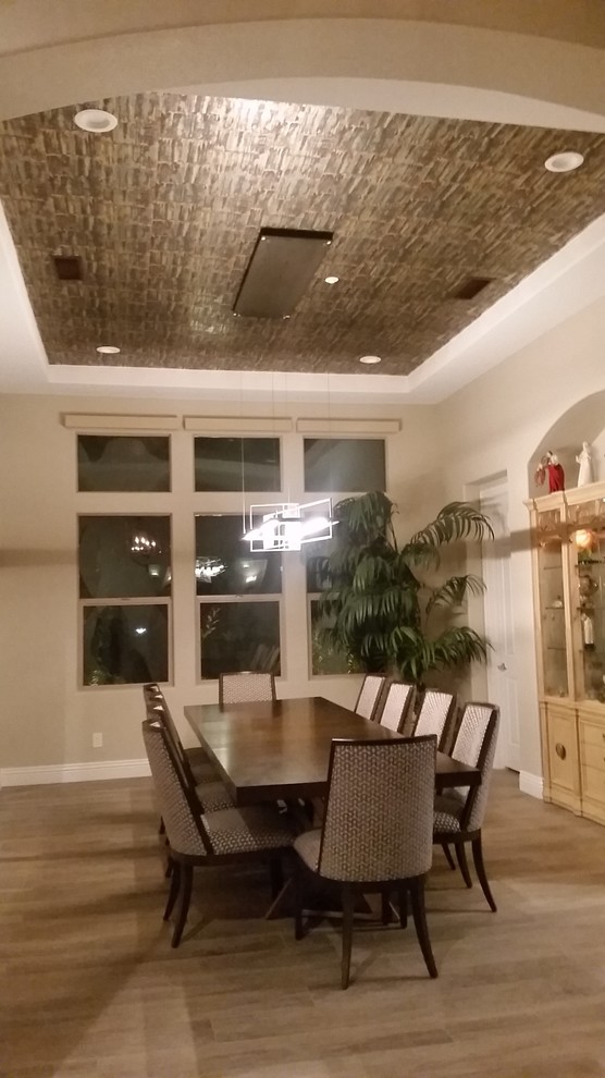 Large eclectic limestone floor and beige floor enclosed dining room photo in Las Vegas with beige walls