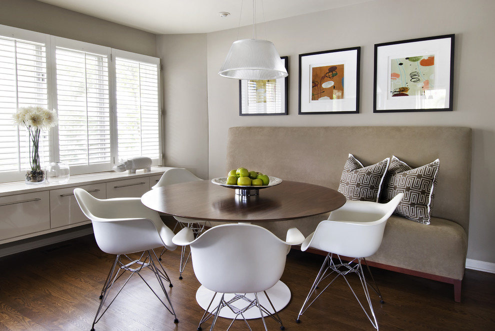 Inspiration for a modern dark wood floor dining room remodel in Detroit with gray walls