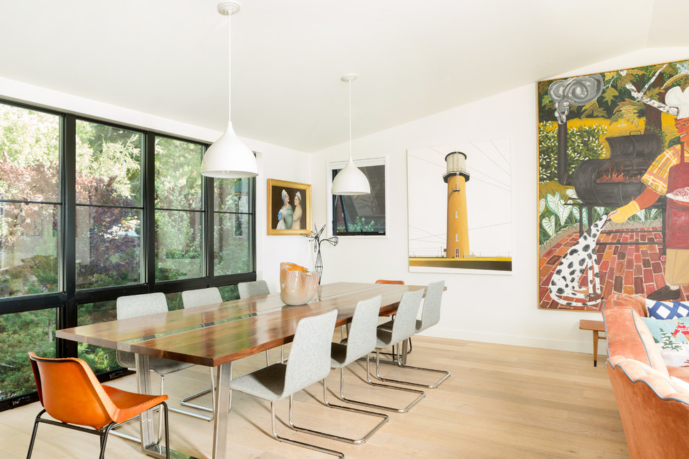 Inspiration for a contemporary light wood floor and beige floor dining room remodel in Sacramento with white walls