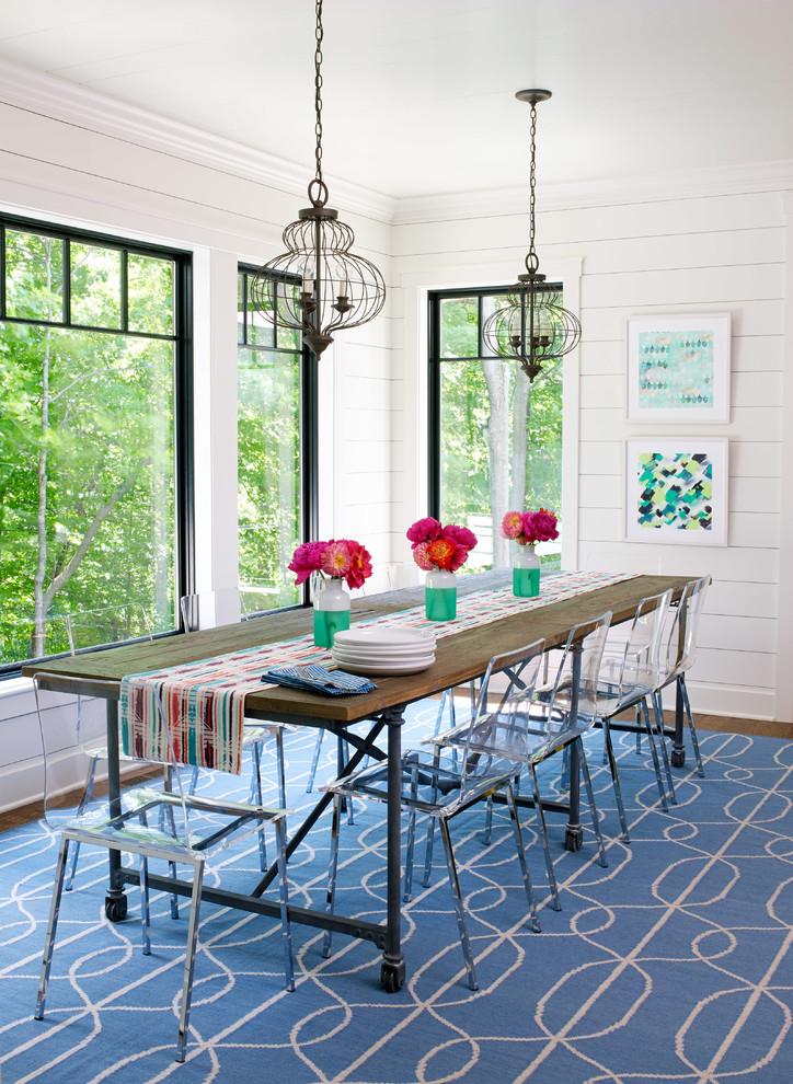 This is an example of a coastal dining room in Minneapolis with white walls.